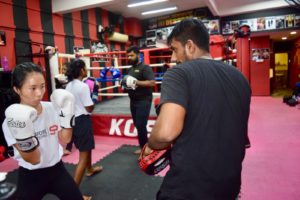 Teenage boxers working on their boxing stances with KOS coaches providing expert guidance.