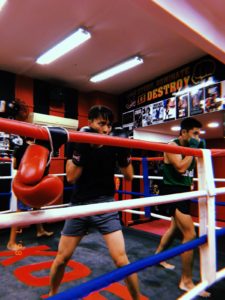 Two boxers in the ring perfecting their boxing stances and posture