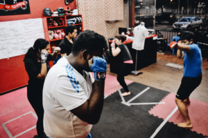 Group class throwing punches with determination