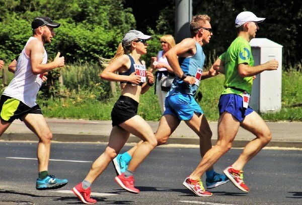 a group of marathon runners racing