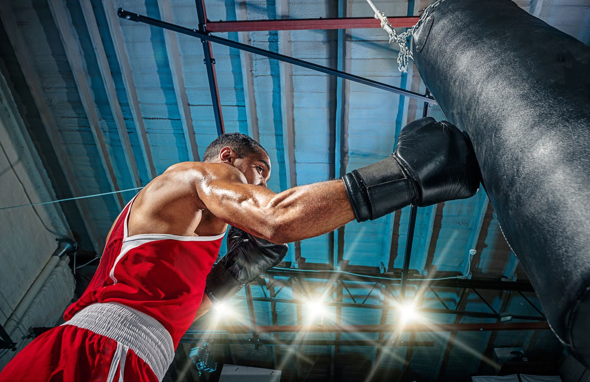 boxer punching punching bag with right hand