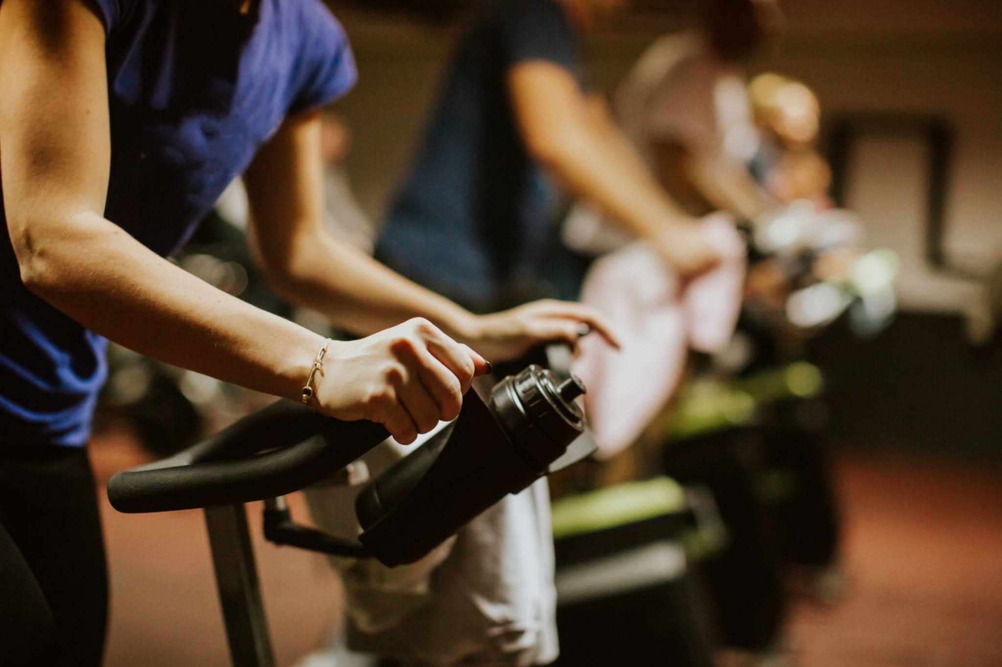 group of people doing cardio spin class